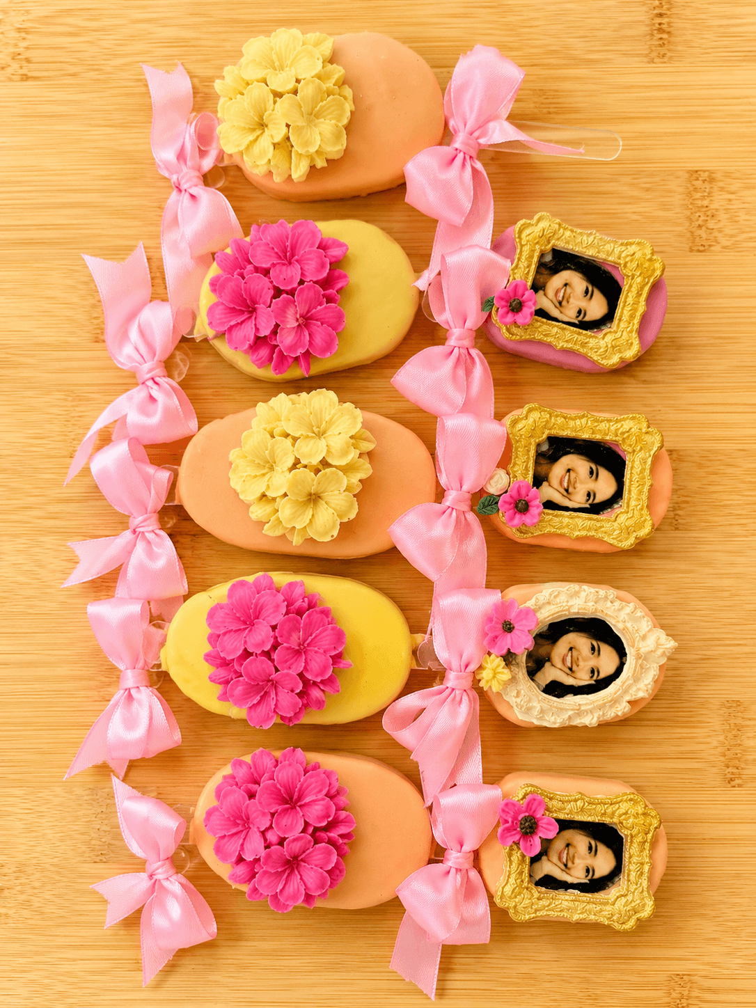 Pink floral cakesicles with personalized edible image photo frames